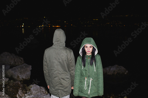Teenage couple looking in opposite directions photo