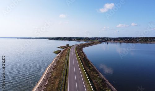 Wallpaper Mural Top view of the road bridge dam over a huge forest lake Torontodigital.ca