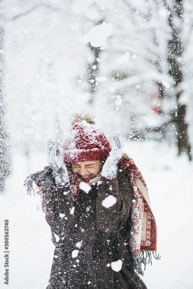 Beautiful woman enjoying the snow in the park Beautiful woman enjoying the snow in the park