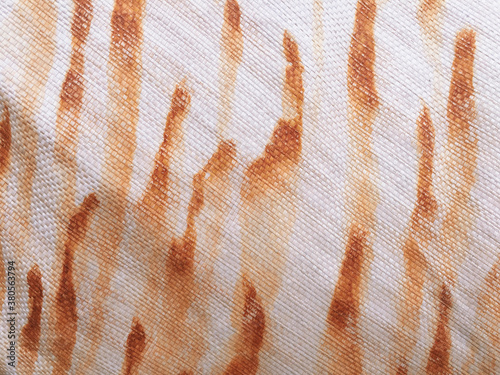 Rust stains on tarpaulin fabric, close up photo