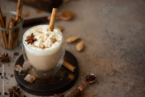 caffe latte with whipped cream, cinnamon and anise