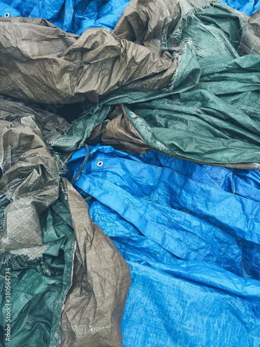 Pile of discarded industrial tarps