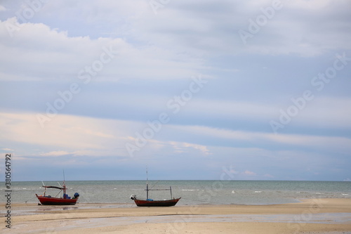 Fishing boat in the cloundy ocean