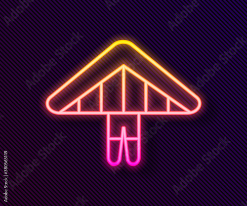 Glowing neon line Hang glider icon isolated on black background. Extreme sport. Vector Illustration.