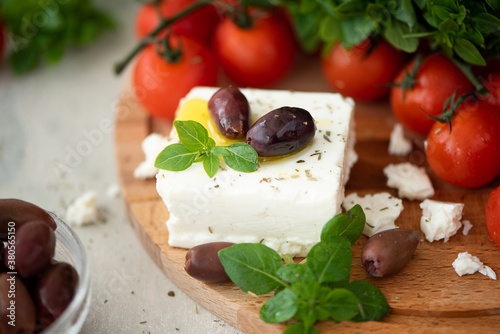 homemade feta cheese with olive oil, tomatoes and basil