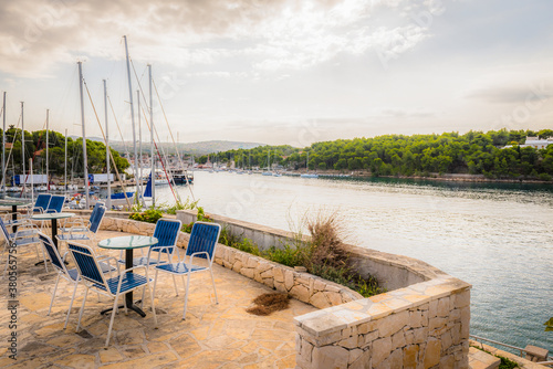 View of the promenade of Milna, Croatia, at sunset in autumn