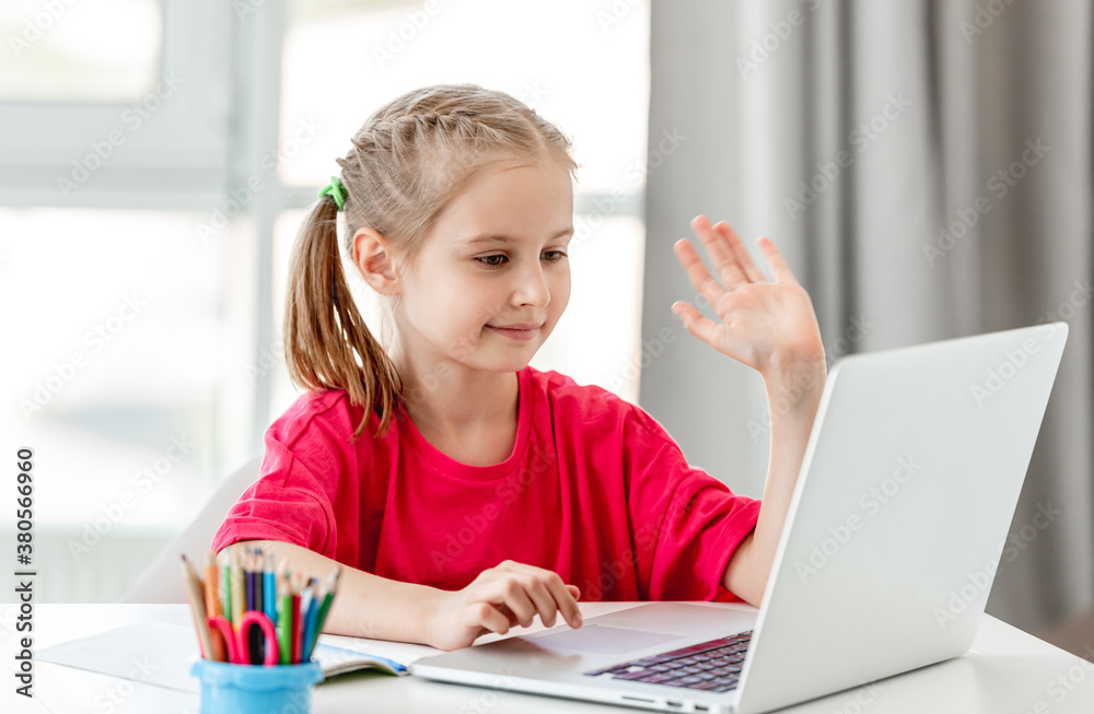 Little girl talking online using laptop Little girl talking online using laptop