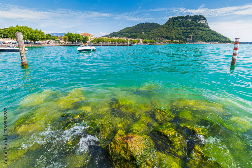 Naklejka premium View over lake at Garda village and port with boats.