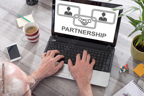 Business partnership concept on a laptop screen