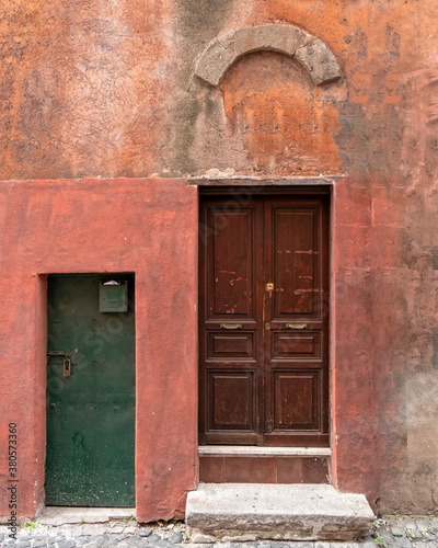 vintage house front entrance green and brown doors, Rome Italy