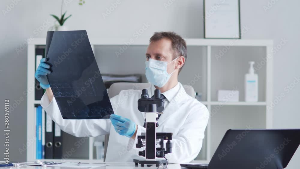 Professional medical doctor working in laboratory using microscope. Professional medical doctor working in laboratory using microscope.
