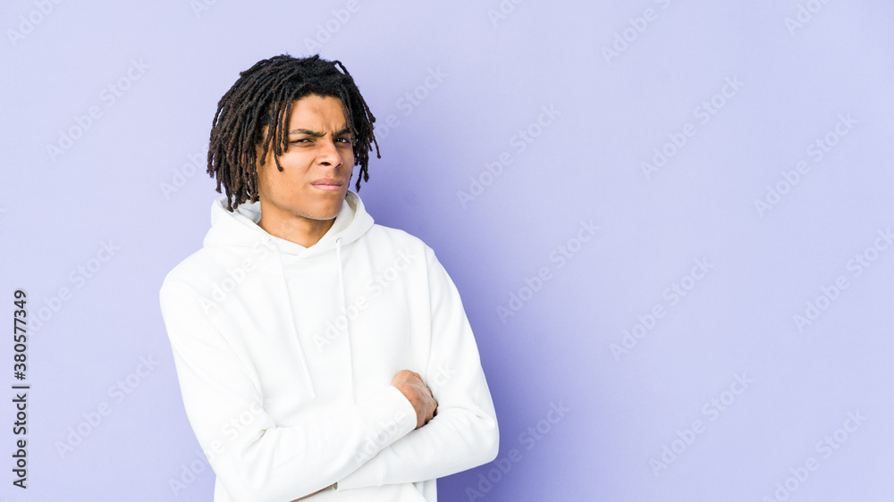 Young african american rasta man unhappy looking in camera with sarcastic expression. Young african american rasta man unhappy looking in camera with sarcastic expression.