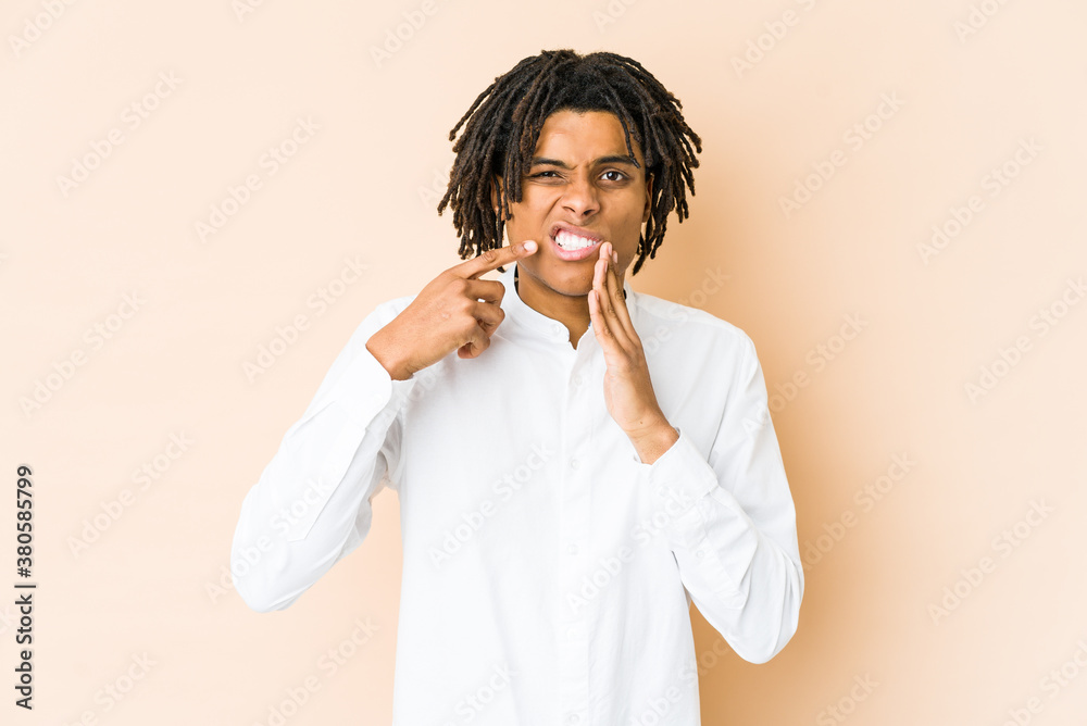 Young african american rasta man having a strong teeth pain, molar ache. Young african american rasta man having a strong teeth pain, molar ache.