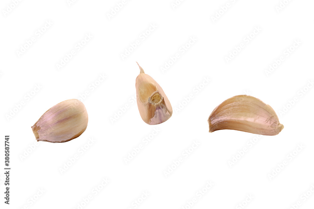 Collection of fresh sliced garlic cloves, isolated on white background