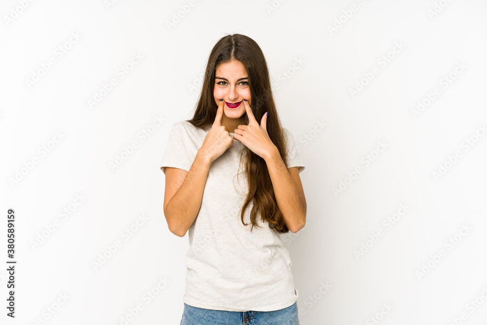 Young caucasian woman isolated on white background doubting between two options. Young caucasian woman isolated on white background doubting between two options.