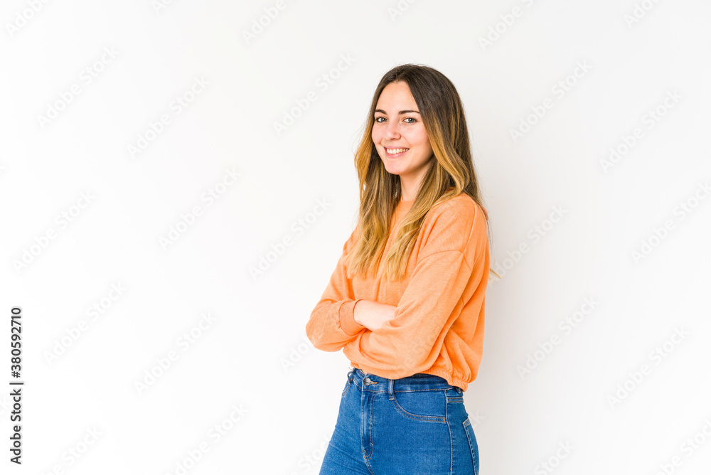 Young caucasian woman isolated on white background happy, smiling and cheerful.