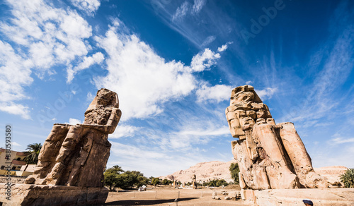 The Colossi of Memnon are two giant stone statues of Pharaoh Amenhotep III. Luxor, West Bank, Egypt photo