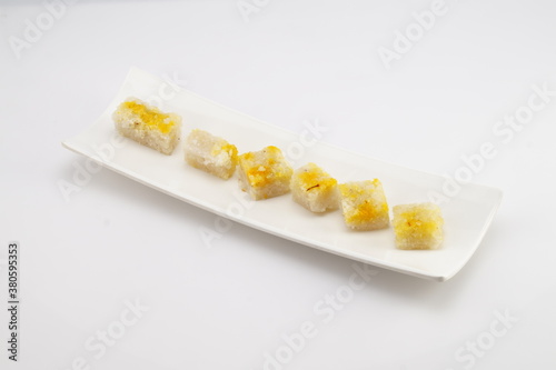 Coconut burfi is a delicious south Indian Sweet recipe made with coconut, sugar, milk and cardamom powder. It is one of the most commonly made sweet during festivals & celebrations in South India.