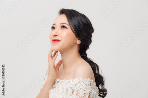 Portrait of beautiful elegant young Asian woman on white background.