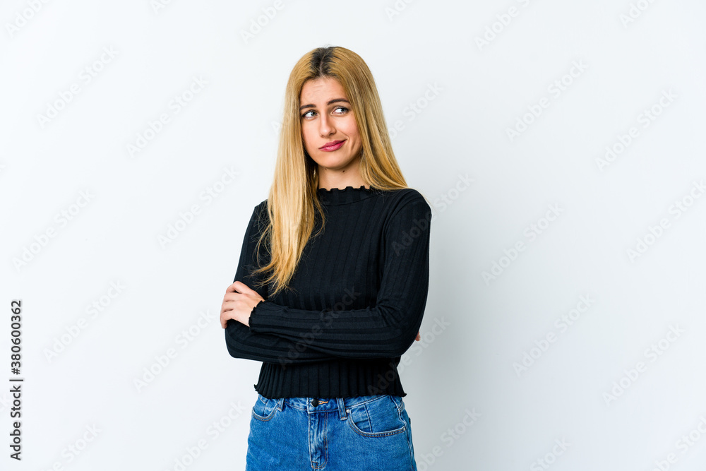 Young blonde woman isolated on white background unhappy looking in camera with sarcastic expression. Young blonde woman isolated on white background unhappy looking in camera with sarcastic expression.