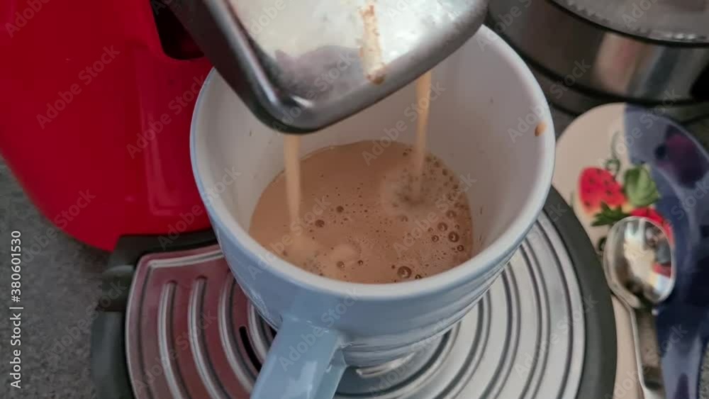Coffee Machine Is dripping Coffee in a blue Mug Coffee Machine Is dripping Coffee in a blue Mug