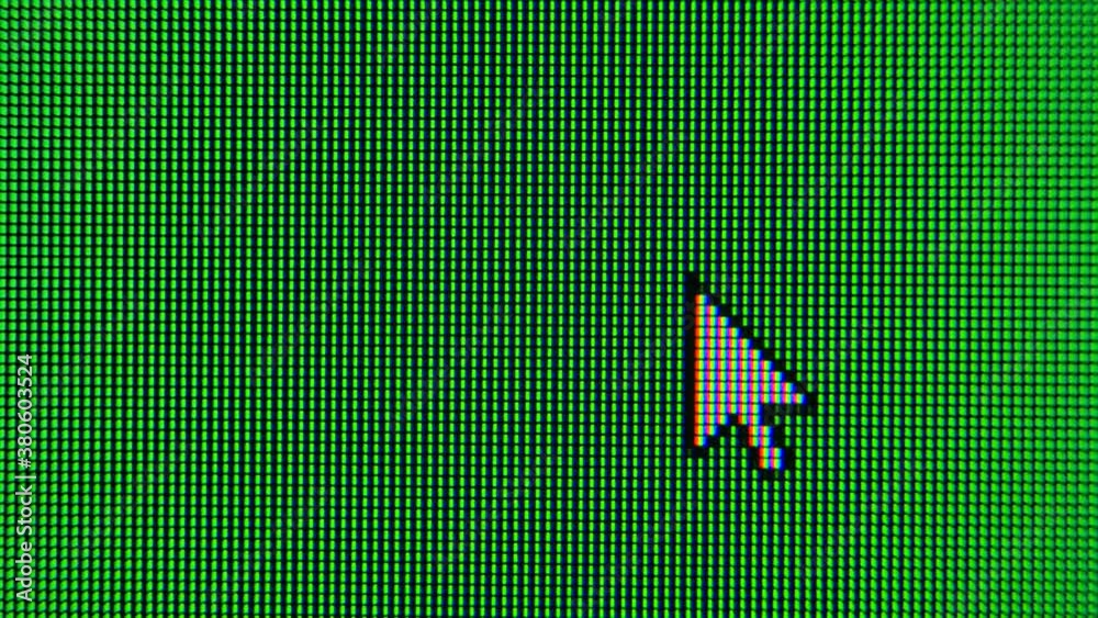 The cursor arrow moves across the green screen and highlights an area. Screen monitor pixels close up.