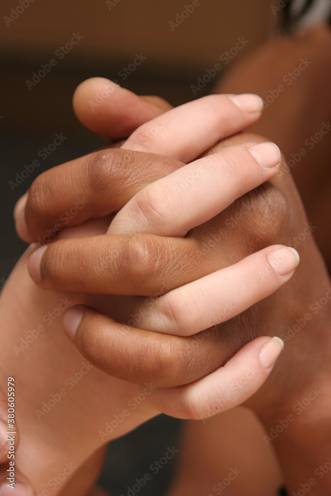 Interracial people man and a woman holding hands Interracial people man and a woman holding hands