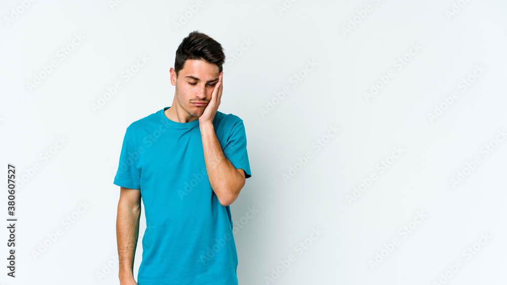 Young caucasian man isolated on white background who is bored, fatigued and need a relax day. Young caucasian man isolated on white background who is bored, fatigued and need a relax day.