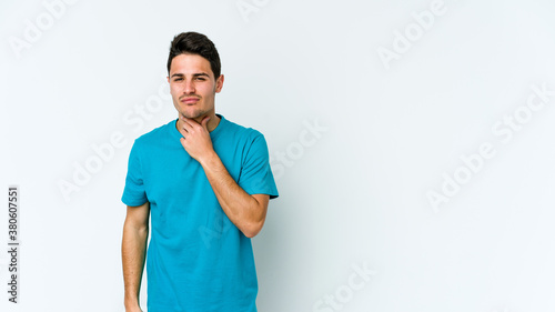 Young caucasian man isolated on white background suffers pain in throat due a virus or infection.