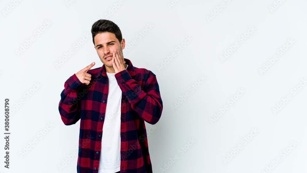 Young caucasian man isolated on white background having a strong teeth pain, molar ache. Young caucasian man isolated on white background having a strong teeth pain, molar ache.