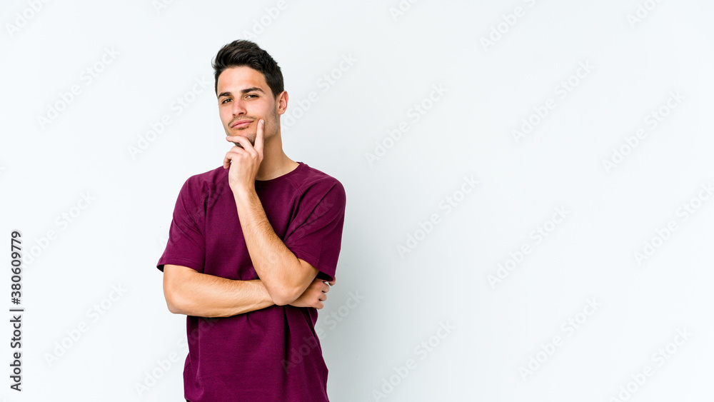 Young caucasian man isolated on white background thinking and looking up, being reflective, contemplating, having a fantasy. Young caucasian man isolated on white background thinking and looking up, being reflective, contemplating, having a fantasy.