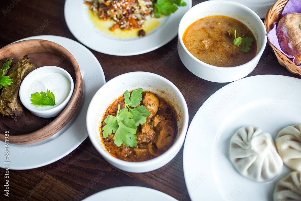 Food concept. Soup, chicken, salat on wooden table Food concept. Soup, chicken, salat on wooden table