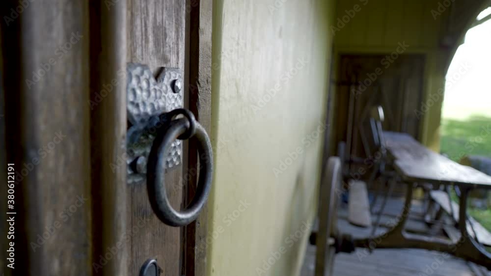 The metal knocker of the door of the big house The metal knocker of the door of the big house