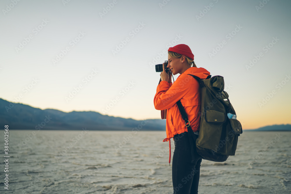 Focused woman taking pictures of nature Focused woman taking pictures of nature