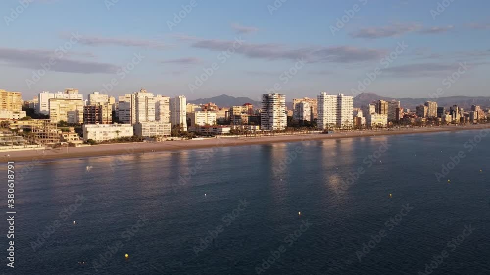 Aerial approach to a coastal Mediterranean town. Playa de San Juan, Alicante, Spain. Aerial approach to a coastal Mediterranean town. Playa de San Juan, Alicante, Spain.
