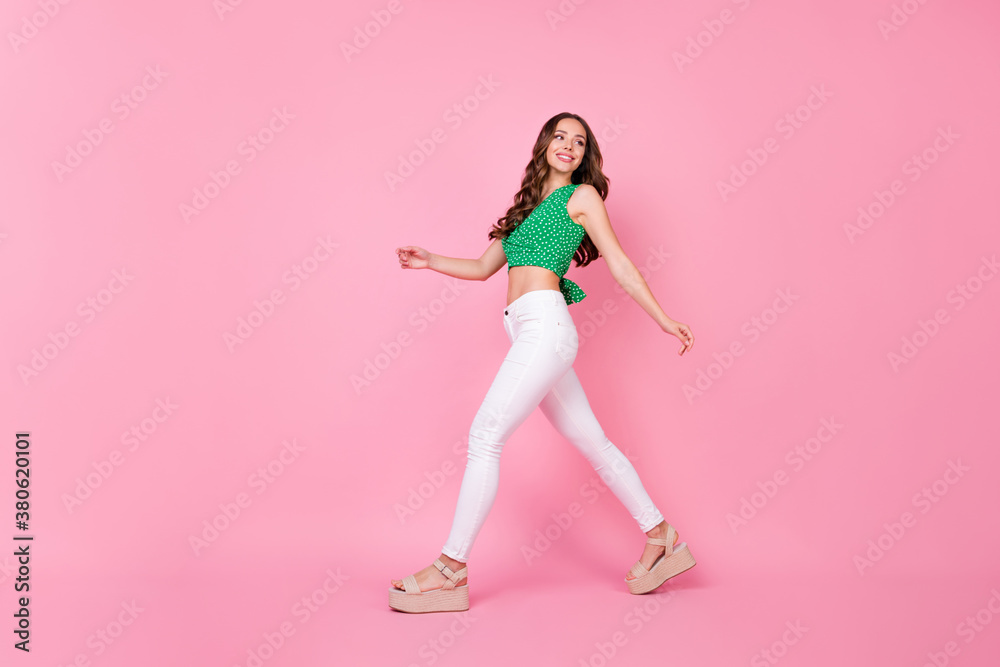Full size profile side photo of sweet nice cute girlish lady go walk copyspace enjoy spring time holiday wear good look clothes isolated over pastel color background Full size profile side photo of sweet nice cute girlish lady go walk copyspace enjoy spring time holiday wear good look clothes isolated over pastel color background