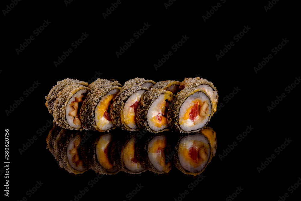 Fresh delicious beautiful sushi rolls on a dark background Fresh delicious beautiful sushi rolls on a dark background