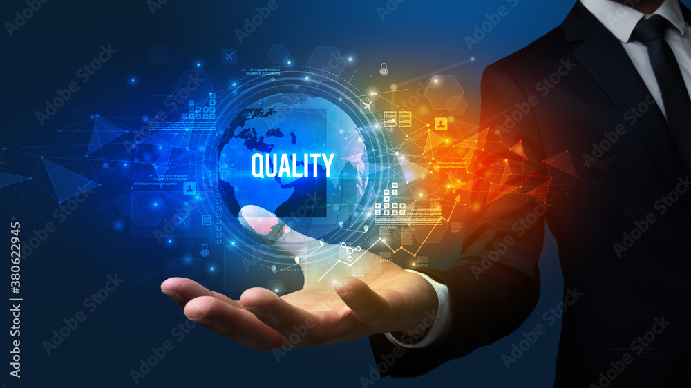 Elegant hand holding QUALITY inscription, digital technology concept Elegant hand holding QUALITY inscription, digital technology concept