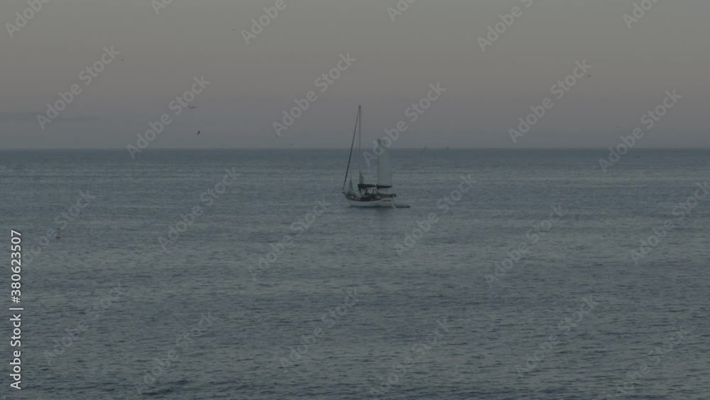 Sailboat anchored off California Shore Dusk Sailboat anchored off California Shore Dusk