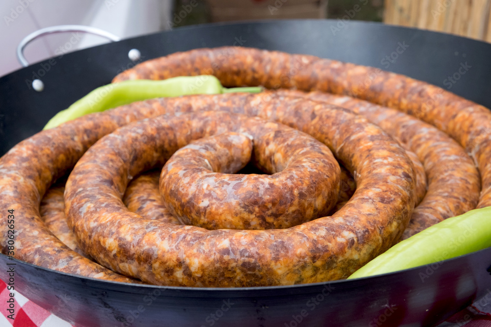 Traditional Serbian meat fst food - grilled sausages on bbq