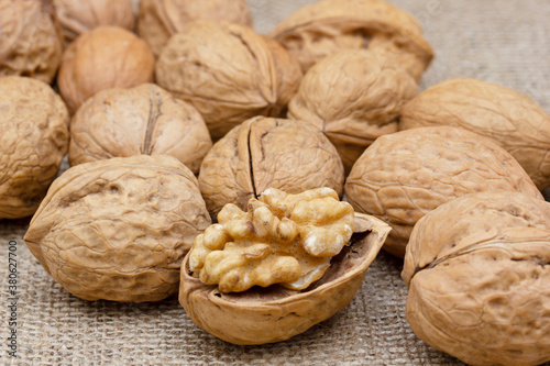 Fresh walnuts on burlap. Healthy food. © Kybele