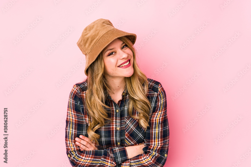 Young caucasian woman wearing a hat isolated laughing and having fun. Young caucasian woman wearing a hat isolated laughing and having fun.