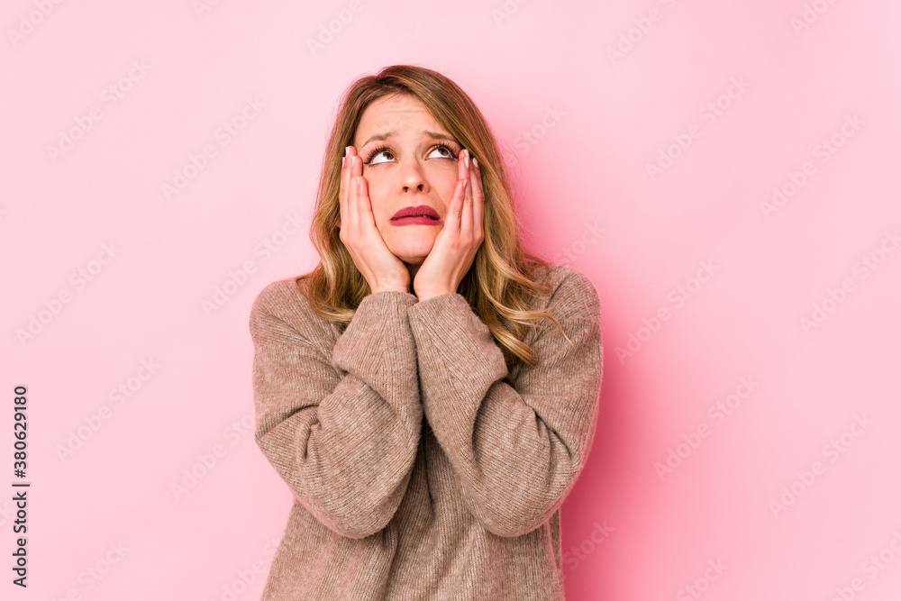 Young caucasian woman isolated on pink background whining and crying disconsolately. Young caucasian woman isolated on pink background whining and crying disconsolately.