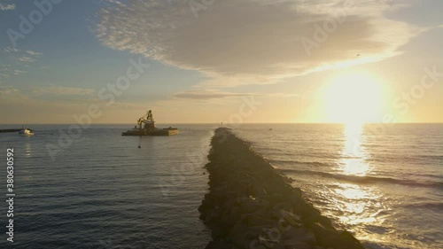 Aerial panning over the breakwater of Mission Beach San Diego photo