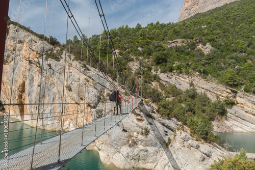 CONGOST DE MONT-REBEI, SPAIN - Sep 15, 2020: Couple in the bridge in  Montrebei gorge in Catalonia, Spain in photo