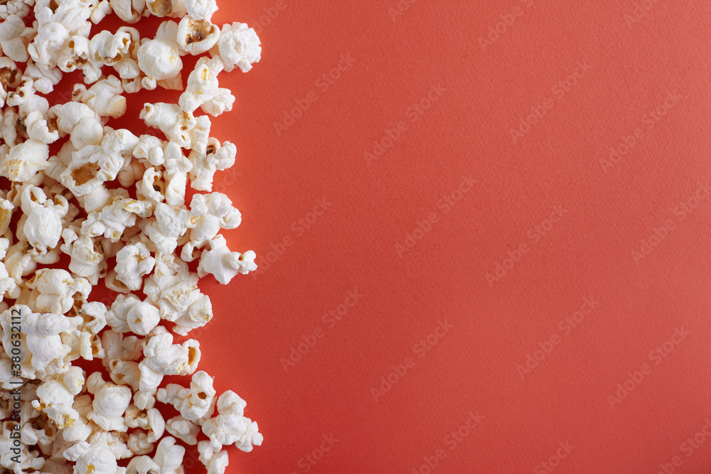 Popcorn on yellow or orange background with copy space top view. Popcorn on yellow or orange background with copy space top view.