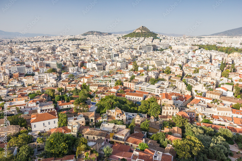 Aerial view of Athens in Greece in a sunny summer day with plenty of white houses.