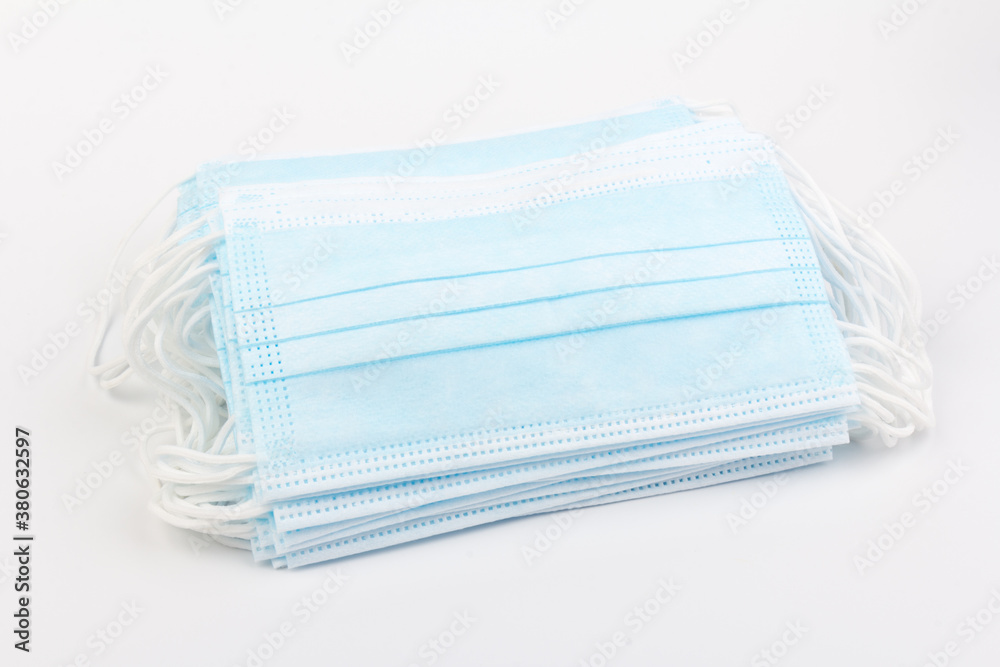 Blue medical masks isolated on white background. Face mask protection against pollution, virus, flu and coronavirus. Blue medical masks isolated on white background. Face mask protection against pollution, virus, flu and coronavirus.