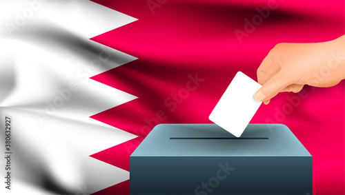 Male hand puts down a white sheet of paper with a mark as a symbol of a ballot paper against the background of the Bahrain flag. Bahrain the symbol of elections
