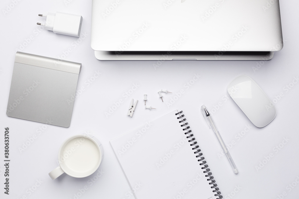 Empty white notebook with pen, working place with keyboard. Empty white notebook with pen, working place with keyboard.